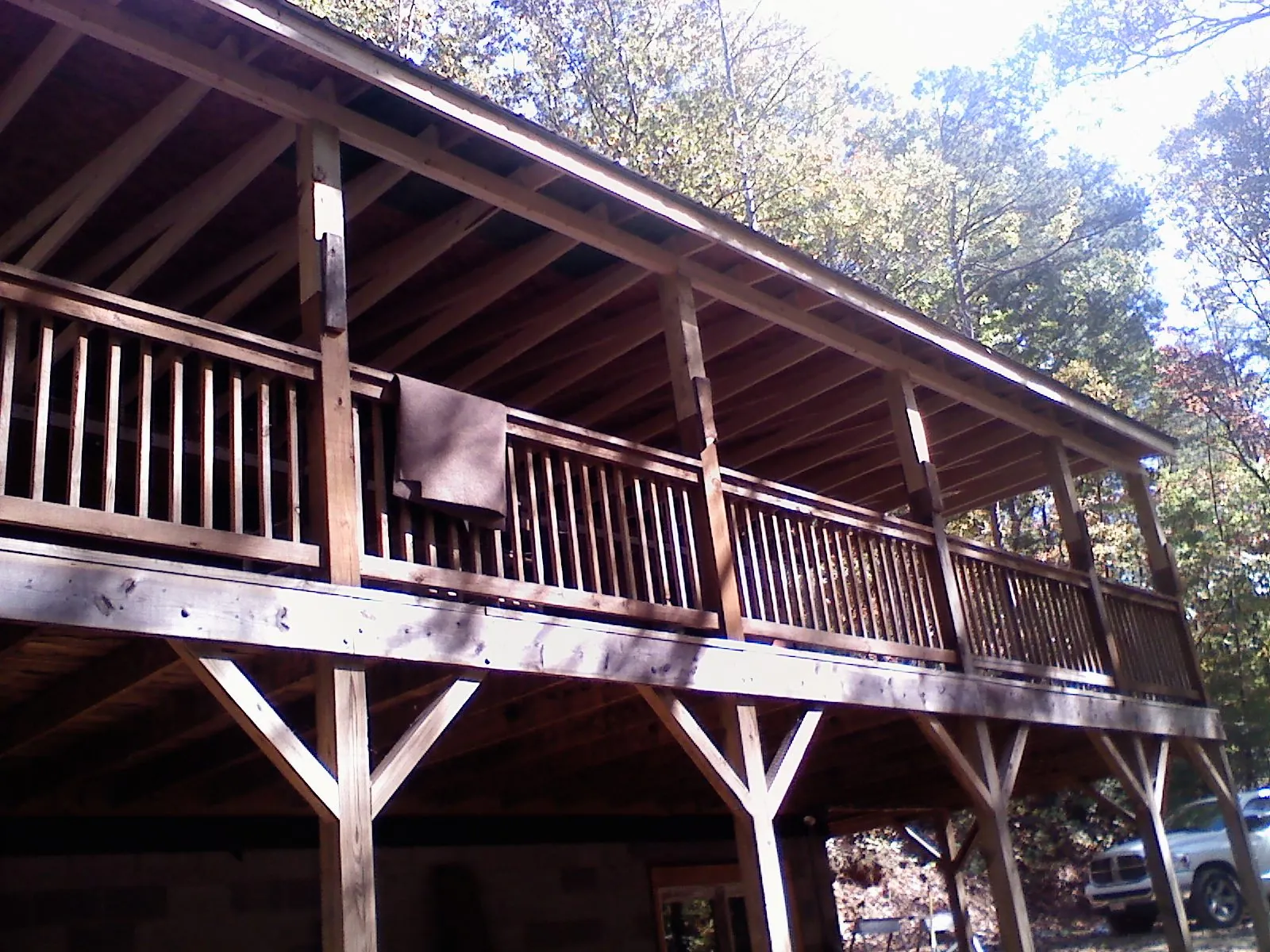 Timber framing under a new elevated porch and deck in Apple Creek